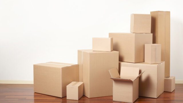 Cardboard boxes in apartment, moving day