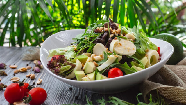 front view fresh salad with arugula avocado and tomato
