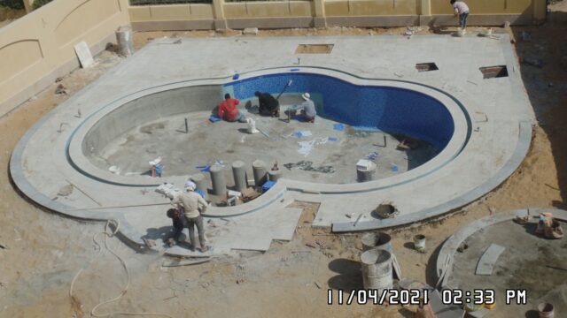 swimming-pools-company-cairo-peanut-pool-tiling-crew-garden